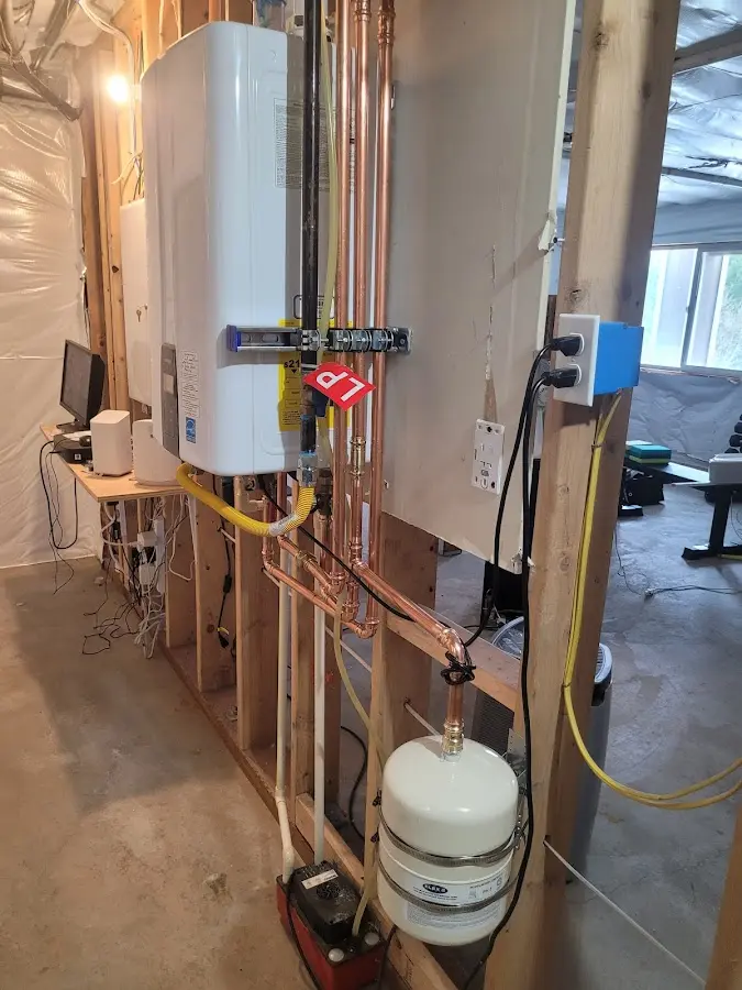 Licensed plumber repairing a kitchen sink in Camden