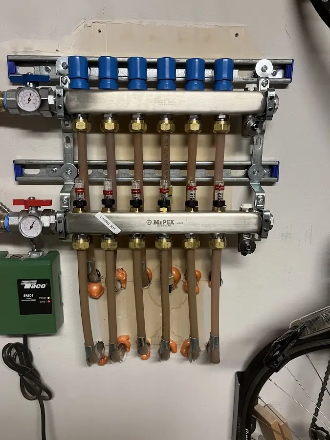 Plumber performing Water Heater Repair at a residential property in Camden